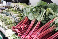 Free piles of asparagus and rhubarb on a market table photo, public domain CC0 image.
