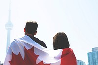 Man and woman wrapped in Canadian flag, free public domain travel CC0 photo.