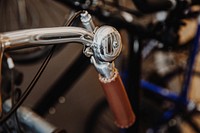 Shiny silver bike bell and handlebars close up, free public domain CC0 image.