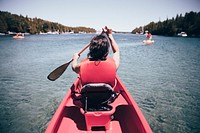 Free woman canoeing in a river image, public domain CC0 photo.