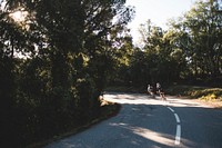 Free two cyclists taking a turn image, public domain activity CC0 photo.