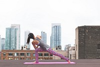 Free woman doing yoga pose on city rooftop building photo, public domain sport CC0 image.