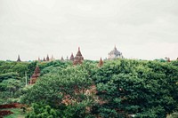 Free rooftops of ancient temple through treetops public domain CC0 photo..