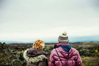 Two friends admiring the scenery, the nature of Iceland. What an amazing adventure for two friends to take together.