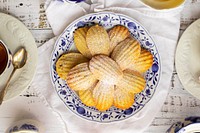 Free madeleine biscuits on dish with tea image, public domain food CC0 photo.