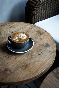 Free cappuccino in cozy cafe photo, public domain beverage CC0 image.