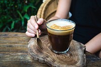 Free black foamy coffee on wooden tray photo, public domain beverage CC0 image.