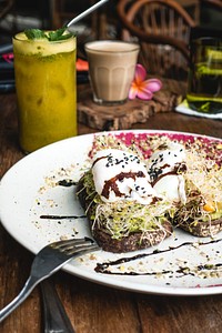 Free breakfast sandwich with poached eggs and sprouts image, public domain food CC0 photo.