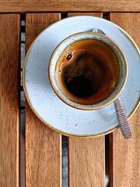 Free espresso cup top view on wooden table photo, public domain beverage CC0 image.