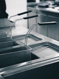 Shiny clean fryer in a restaurant kitchen, free public domain CC0 image.