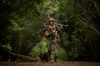 U.S. Marine Corps Lance Cpl. Marc Mercado, assigned to the Advanced Infantry Marine Course (AIMC), carries an M240B machine gun during casualty evacuation drills aboard Kahuku Training Area, Hawaii, May 1, 2018.