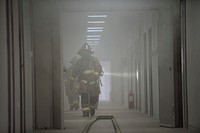 U.S. Air Force firefighters assigned to the 332d Expeditionary Civil Engineer Squadron clear rooms after responding to a simulated structure fire as part of a coalition emergency response exercise February 9, 2018, at an undisclosed location in Southwest Asia. The scenario called for the Airmen to locate and rescue a missing person trapped in the smoke.