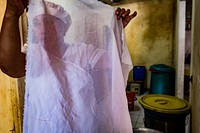 Woman chef holding white cloth, Puerto Princesa, Palawan, Philippines, July 2017.