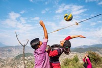 People playing volleyball on mountain, Kailash, Bajhang District, Nepal, October 2017.