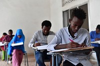Secondary students take their national examinations in Mogadishu, Somalia, on 22 May 2018. Original public domain image from <a href="https://www.flickr.com/photos/au_unistphotostream/40557789140/" target="_blank">Flickr</a>