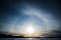 A 22-degree halo around the sun is seen as it sets on the frozen Shagawa Lake, Ely, MN on March.