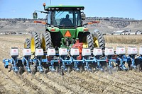 Brian Kindsfather plants no-till sugar beets into corn residue on his farm near Laurel, Mont. Yellowstone County. April 2018. Original public domain image from Flickr