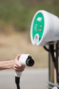 NREL,-owned electric vehicles (EVs) below solar canopy at the Vehicle Testing & integration Facility (VTIF), where vehicles are charged with photovoltaic (PV) - generated electricity and can provide backup energy to the grid when PV generation is low.