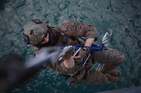 A U.S. Marine with Force Reconnaissance Company, 3rd Reconnaissance Battalion, 3rd Marine Division, III Marine Expeditionary Force climbs an insertion ladder during a simulated raid aboard the submarine tender USS Frank Cable (AS 40) March 21, 2017, in Guam. The 3rd Marine Division Marines are in Guam conducting special insertion and raids training with J Company, 42 Commando and U.S. Sailors with Explosive Ordinance Disposal Mobile Unit 5. (U.S. Marine Corps photo by Sgt. Carl King).