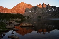 Sunset and shadows of Cirque of the Towers (west side) looking across Shadow Lake in Bridger Wilderness, Bridger-Teton National Forest, Wyoming, August 24, 2011. (Forest Service photo by Greg Bevenger). Original public domain image from Flickr