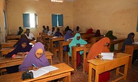 Secondary students take their national examinations in Baidoa, Somalia, on 22 May 2018. Over 27,000 secondary school students in Somalia began national examinations on Saturday. The exams will be conducted in 120 centers across the capital and four federal states that include Galmudug, Hirshabelle, Southwest, and Jubbaland. UN Photo. Original public domain image from Flickr