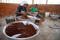 USAID in Ghana: Shea Butter Processing. USAID and the Global Shea Alliance partner to connect West Africa village women to the global marketplace. Photo: Scott Fountaine/USAID. Original public domain image from Flickr