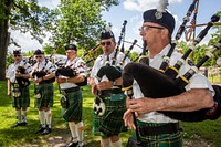 Bagpipers with the Atlantic City Fire Department Sandpipers Bagpipe Ensemble perform Amazing Grace during the Memorial Day ceremony for the residents of the New Jersey Veterans Memorial Home at Vineland, N.J., May 23, 2018. The ceremony honored both the Home’s veterans, as well as residents who passed away since the 2017 Memorial Day ceremony. (New Jersey Department of Military and Veterans Affairs photo by Mark C. Olsen). Original public domain image from Flickr