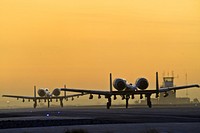 A pair of A-10C Thunderbolts from the 354th Expeditionary Fighter Squadron taxi down the runway at Kandahar Airfield, Afghanistan, Dec. 27, 2009. (U.S. Air Force photo by Tech. Sgt. Efren Lopez/Released). Original public domain image from Flickr