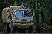 U.S. Soldiers assigned to the New Jersey Army National Guard's 253rd Transportation Company look for simulated enemy forces during convoy training on Joint Base McGuire-Dix-Lakehurst, N.J., May 17, 2018.