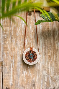 Rattan hand bag hanging outside. Free public domain CC0 photo.