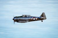 Arctic Thunder Open House July 1, 2018A BT-13 Valiant pilot performs an aerial display during the Arctic Thunder Open House on Joint Base Elmendorf-Richardson, Alaska, July 1, 2018. During the biennial open house, JBER opens its gates to the public and hosts multiple performers including the U.S. Air Force Thunderbirds, JBER Joint Forces Demonstration and the U.S. Air Force F-22 Raptor Demonstration Team. (U.S. Air Force photo by Senior Airman Javier Alvarez). Original public domain image from Flickr