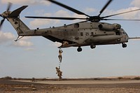 U.S. Air Force pararescuemen conduct a combat insertion and extraction exercise with a Marine Corps CH-53 Super Stallion helicopter attached to Heavy Marine Helicopter Squadron (HMH) 464 in Djibouti Jan. 5, 2010.