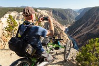 Photographing the Grand Canyon of the Yellowstone from an off-road wheelchair by Jacob W. Frank. Original public domain image from Flickr