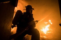 A Fighterfighter battles a blaze during live burn training at the Anthony &quot;Tony&quot; Canale Training Center in Egg Harbor Township, N.J., Sept. 18, 2018.