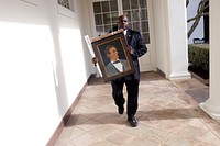 Rob Robinson from the Correspondence Office walks on the Colonnade carrying a gift portrtait of Abraham Lincoln to the West Wing of the White House, Jan. 13, 2010.