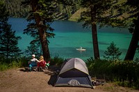 A couple enjoys the view and the recreation available at the campgrounds at Wade Lake in the Beaverhead-Deerlodge National Forest.