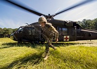 A U.S. Army UH-60 Black Hawk helicopter crew assigned to the South Carolina Army National Guard, Charlie Co., 2-238 Aviation Battalion provides medevac support during Exercise STEPPE EAGLE 18 at McCrady Training Center, Eastover, South Carolina, Aug. 17, 2018.