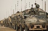 U.S. Soldiers with Bravo Company, 4th Battalion, 23th Infantry Regiment inspect their equipment at Camp Tombstone in Helmand province, Afghanistan, Feb. 6, 2010. (U.S. Air Force photo by Tech. Sgt. Efren Lopez/Released). Original public domain image from Flickr