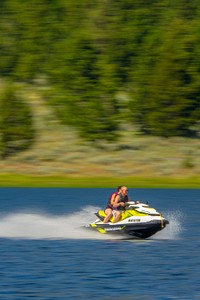 Family rides their jet ski on Delmoe Lake in Beaverhead-Deerlodge National Forest. Original public domain image from <a href="https://www.flickr.com/photos/usforestservice/43779225672/" target="_blank">Flickr</a>