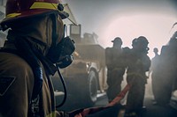 U.S. Sailors combat a simulated fire during a Damage Control Training Team (DCTT) exercise in the well deck of the amphibious assault ship USS Wasp (LHD 1) in the East China Sea, October 23, 2018.