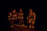 Fighterfighters wait for their turn to enter a building during live burn training at the Anthony "Tony" Canale Training Center in Egg Harbor Township, N.J., Sept. 18, 2018.