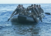U.S. Marines assigned to the 31st Marine Expeditionary Unit launch a combat rubber raiding craft (CRRC) from the stern gate of the forward-deployed amphibious assault ship USS Essex (LHD 2) while under way in the South China Sea March 3, 2010, during a CRRC training mission.