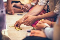 Balinese men playing cards. Free public domain CC0 photo.