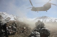 U.S. Soldiers and Afghan National Army soldiers prepare to board a CH-47 Chinook helicopter after conducting a patrol in the village of Akbar Kheyl in the Pole-Elam district of the Logar province of Afghanistan March 18, 2010.