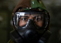 Senior Airman Eusaybia Parker wears her M50 gas mask during an ability to survive and operate training class on Joint Base McGuire-Dix-Lakehurst, N.J., Oct. 20, 2018.