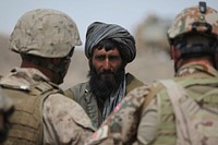 Marines speak to Afghan man