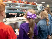 U.S. Department of Agriculture (USDA) Agriculture Secretary Sonny Perdue serves corn on the cob, at the Discovery Elementary School, in Arlington, VA, on October 18, 2018, during National School Lunch Week, October 15-19, 2018.