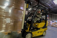 U.S. Army Staff Sgt. Amber Knickman, a Supply Specialist with the New Jersey Army National Guard, moves pallets of gear during a Rapid Fielding Initiative (RFI) on Joint Base McGuire-Dix-Lakehurst, N.J., Oct. 24, 2018.