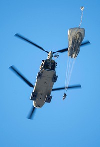 Army paratroopers assigned to the 4th Infantry Brigade Combat Team (Airborne), 25th Infantry Division, U.S. Army Alaska, jump from a CH-47 Chinook helicopter during airborne training at Joint Base Elmendorf-Richardson, Alaska, Nov. 1, 2018. The Soldiers of 4/25 belong to the only American airborne brigade in the Pacific and are trained to execute airborne maneuvers in extreme cold weather and high altitude environments in support of combat, partnership and disaster relief operations. Army aviators from B Company, 1st Battalion, 52nd Aviation Regiment out of Fort Wainwright, operated CH-47 Chinook helicopters to support the airborne training. (U.S. Air Force photo by Alejandro Peña). Original public domain image from Flickr