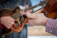 Musicians playing violin in a jam session. Original public domain image from Flickr